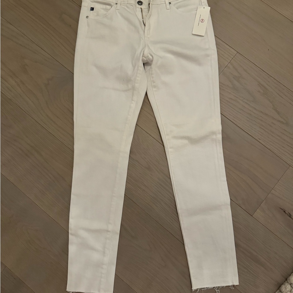 AG white jeans with frayed leg openings nwt